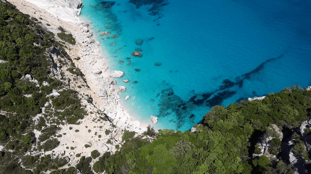 Rocky cliff edge and blue sea in the Mediterranean island of Sardinia