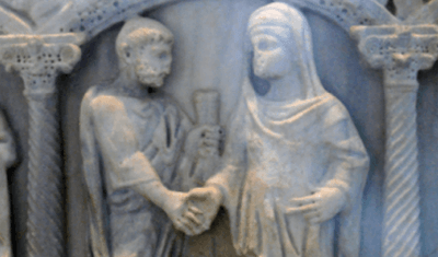 A stone carving of a Roman marriage scene