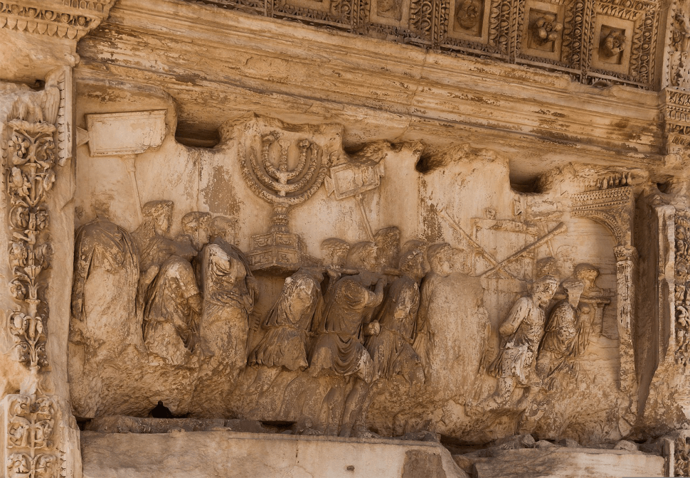 A relief on the Arch of Titus showing the Menorah being carried away by Roman soldiers