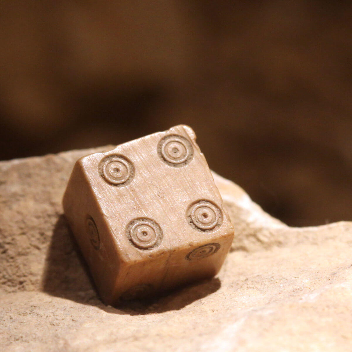 An ancient Roman dice on display at The Roman Museum in Lausanne-Vidy, Switzerland