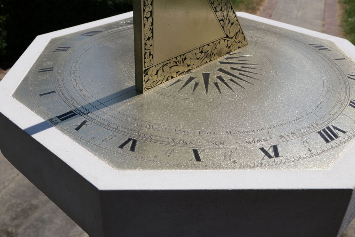 A sundial featuring Roman numerals representing the hours