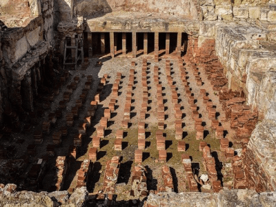Hypocaust pillars underneath a Roman bath floor for heating water