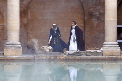 A wealthy Roman woman and her slave at the Roman baths